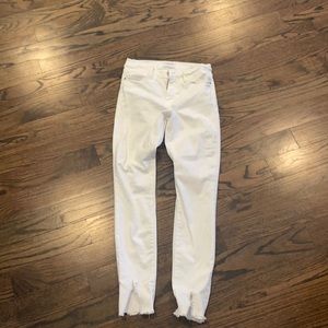 Frame white jeans. Barely worn. Frayed bottom.